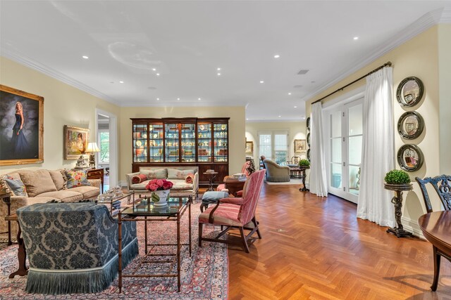 living area with baseboards, recessed lighting, and crown molding