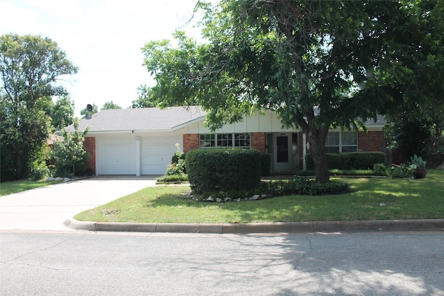 4605 Avoca St, Fort Worth, TX 76132 - ranch-style home with brick siding, an attached garage, concrete driveway, and a front yard