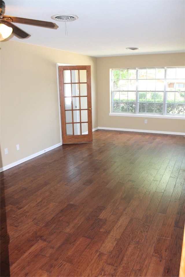4605 Avoca St, Fort Worth, TX 76132 - spare room with dark wood-type flooring, a ceiling fan, and baseboards