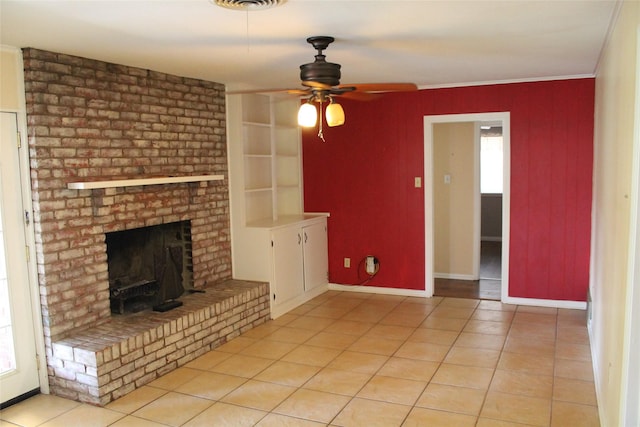 4605 Avoca St, Fort Worth, TX 76132 - unfurnished living room with light tile patterned floors, ceiling fan, a brick fireplace, ornamental molding, and baseboards