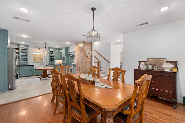 320 Eastwood Ave, Fort Worth, TX 76107 - dining area with stairs, light wood finished floors, and recessed lighting