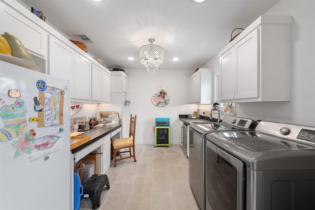 320 Eastwood Ave, Fort Worth, TX 76107 - washroom with independent washer and dryer, cabinet space, recessed lighting, light tile patterned flooring, and baseboards