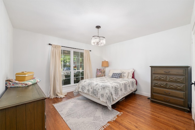 320 Eastwood Ave, Fort Worth, TX 76107 - bedroom featuring a chandelier and wood finished floors