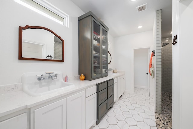 320 Eastwood Ave, Fort Worth, TX 76107 - bar area featuring a sink, light tile patterned floors, and recessed lighting