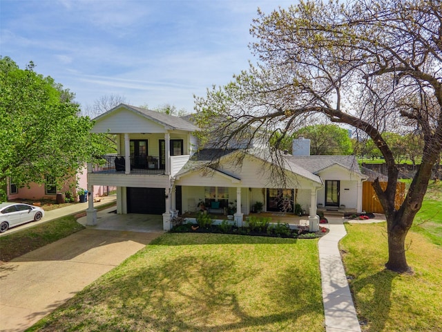 320 Eastwood Ave, Fort Worth, TX 76107 - view of front of property featuring a balcony, a front lawn, a porch, a garage, and driveway