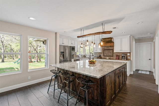 161 Mariah Dr, Weatherford, TX 76087 - kitchen featuring appliances with stainless steel finishes, baseboards, white cabinets, and recessed lighting