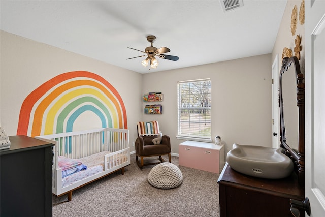 161 Mariah Dr, Weatherford, TX 76087 - carpeted bedroom with a nursery area and a ceiling fan