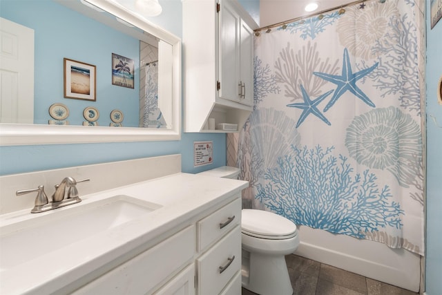 full bath with vanity, a shower with shower curtain, and toilet