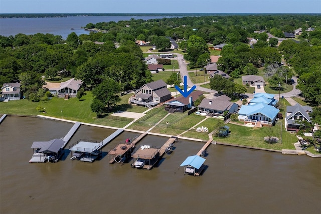 birds eye view of property with a residential view and a water view