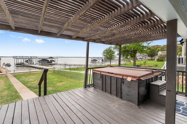 wooden deck with a lawn, a pergola, a water view, and a hot tub