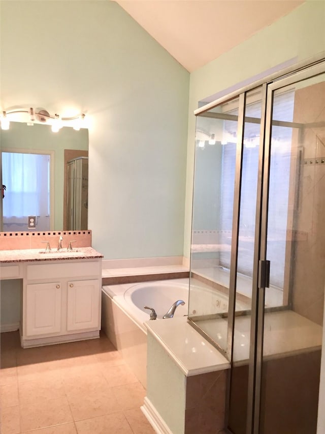 full bath with vanity, a shower stall, lofted ceiling, tile patterned flooring, and a bath