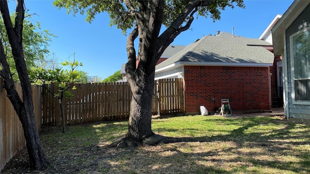 view of yard featuring a fenced backyard