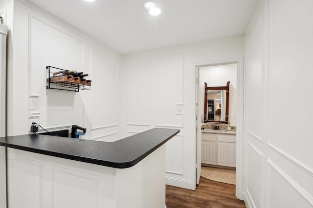 3415 W Fm 5th Rd, Aledo, TX 76008 - bar with dark wood-style flooring, a sink, a decorative wall, and recessed lighting