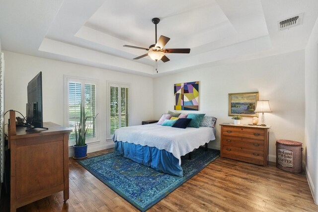 3415 W Fm 5th Rd, Aledo, TX 76008 - bedroom with a tray ceiling, wood finished floors, and baseboards