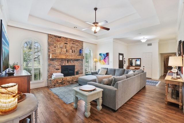 3415 W Fm 5th Rd, Aledo, TX 76008 - living room featuring a tray ceiling, hardwood / wood-style flooring, ceiling fan, and a brick fireplace