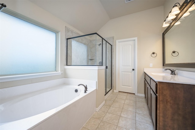 bathroom with a stall shower, tile patterned flooring, vanity, and a garden tub