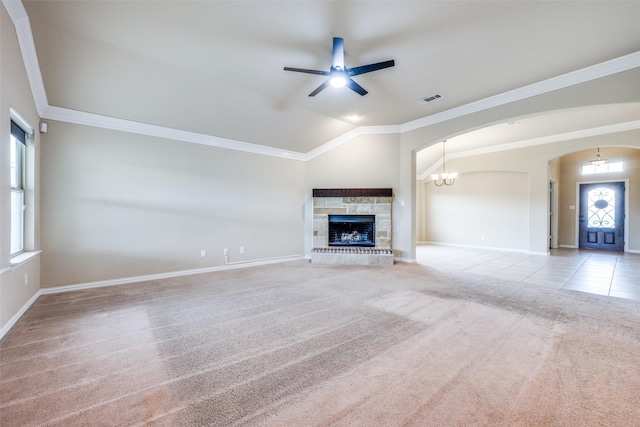 unfurnished living room featuring lofted ceiling, carpet flooring, ornamental molding, visible vents, and a ceiling fan