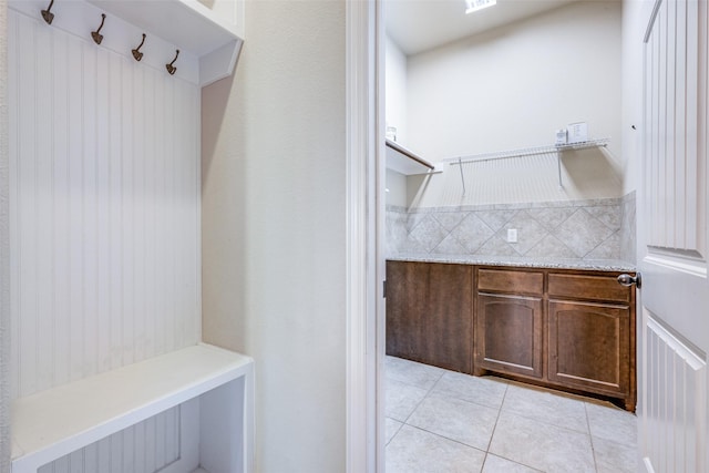 mudroom featuring light tile patterned flooring