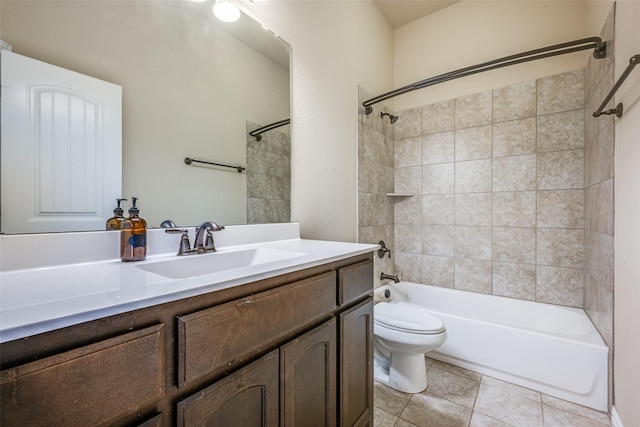 bathroom featuring toilet, vanity, shower / tub combination, and tile patterned flooring