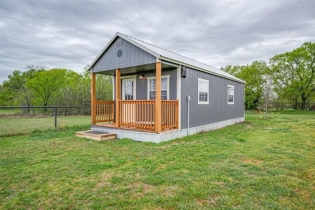 view of outbuilding with fence
