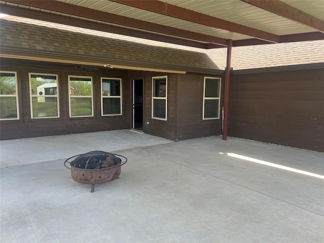 view of patio with an outdoor fire pit