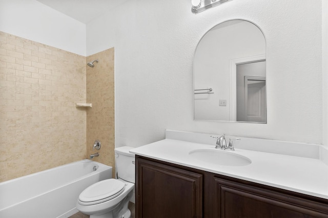 bathroom with toilet, shower / washtub combination, and vanity