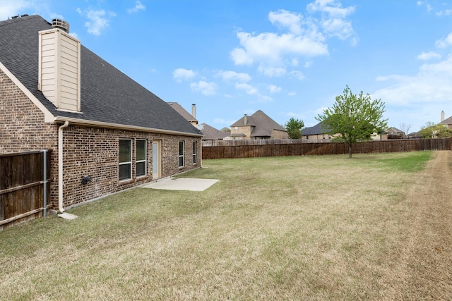 view of yard featuring a fenced backyard