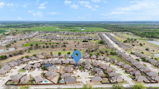 bird's eye view with a water view and a residential view