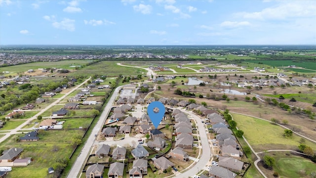 drone / aerial view featuring a water view and a residential view
