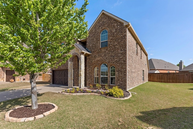 view of front of property with driveway, a garage, brick siding, fence, and a front lawn