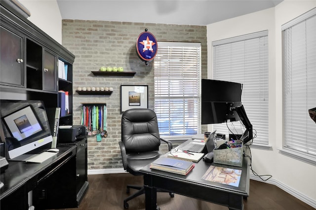office space featuring baseboards, a wealth of natural light, and dark wood finished floors