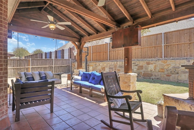view of patio with outdoor lounge area, a ceiling fan, and a fenced backyard