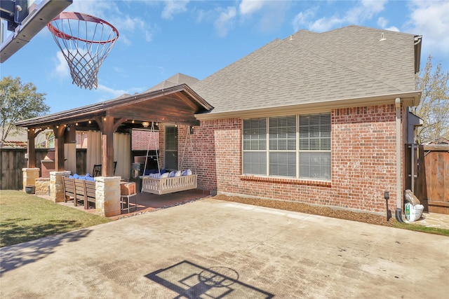 view of patio with fence and outdoor lounge area
