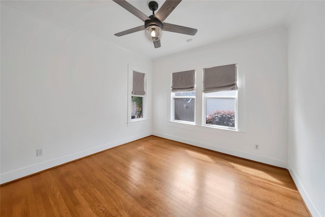 930 N Clinton Ave, Dallas, TX 75208 - unfurnished room featuring baseboards, wood finished floors, and a ceiling fan