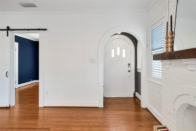 930 N Clinton Ave, Dallas, TX 75208 - spare room featuring a ceiling fan, baseboards, wood finished floors, and crown molding