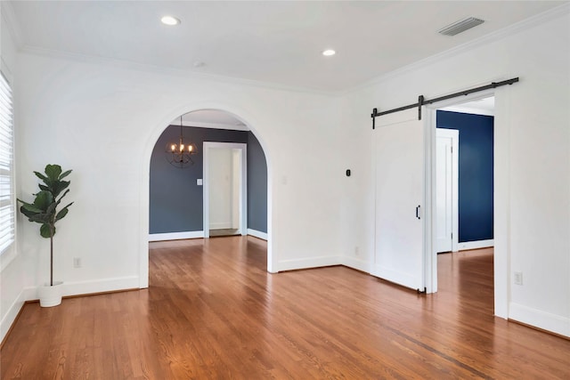 930 N Clinton Ave, Dallas, TX 75208 - spare room with wood finished floors, a chandelier, ornamental molding, and baseboards