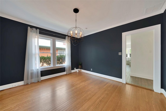 930 N Clinton Ave, Dallas, TX 75208 - spare room with wood finished floors, a chandelier, ornamental molding, and baseboards