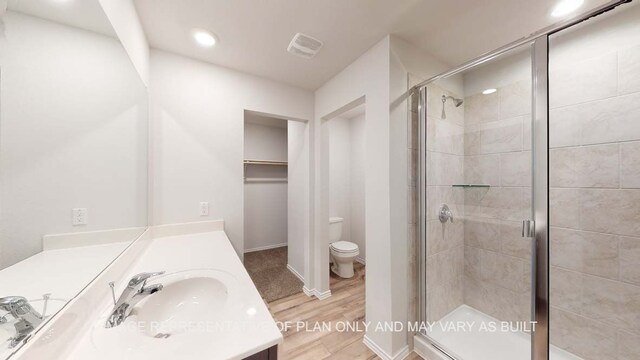 12520 Tarres Ct, Lorena, TX 76655 - bathroom with visible vents, a shower stall, toilet, wood finished floors, and vanity
