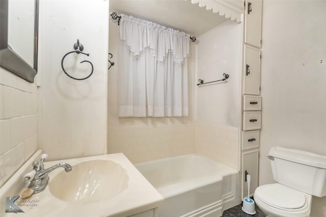 full bath featuring toilet and a sink