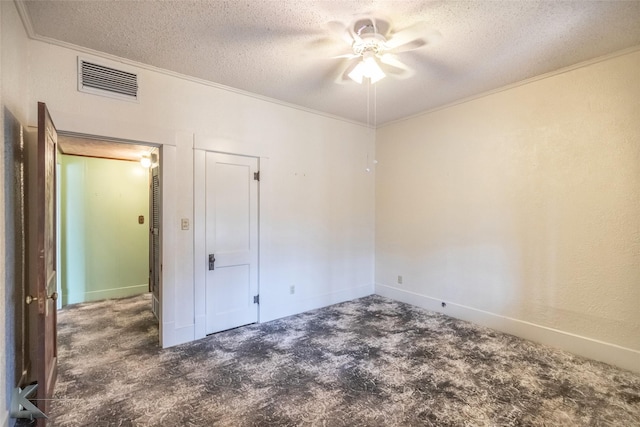 unfurnished bedroom featuring crown molding, baseboards, a textured ceiling, ceiling fan, and visible vents