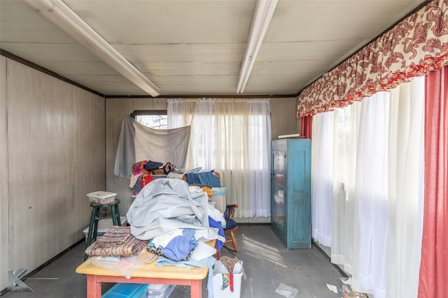 miscellaneous room with unfinished concrete flooring