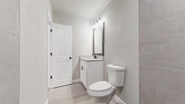 5609 Maceo Ln, Fort Worth, TX 76112 - bathroom with toilet, vanity, and baseboards