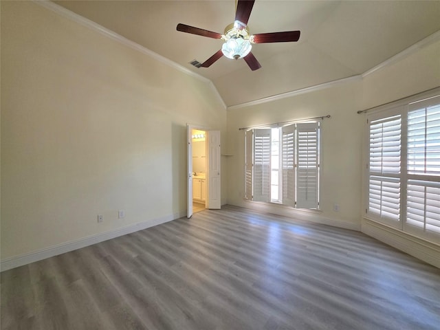 701 Canal St, Irving, TX 75063 - unfurnished room featuring healthy amount of natural light, ornamental molding, ceiling fan, baseboards, and lofted ceiling