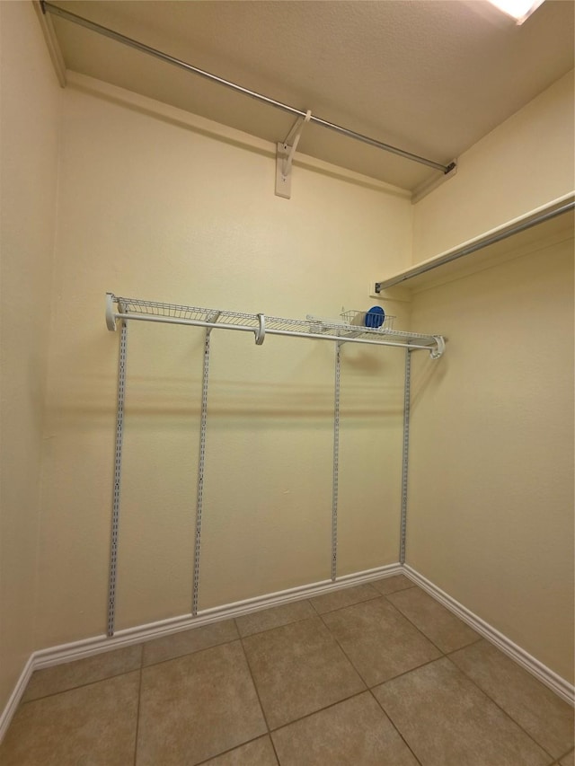 701 Canal St, Irving, TX 75063 - spacious closet with tile patterned floors