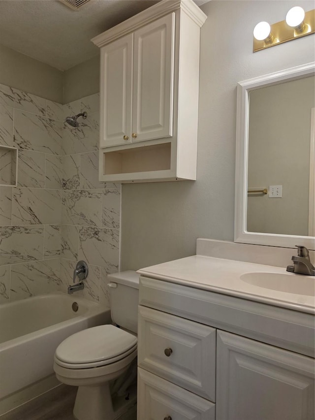 701 Canal St, Irving, TX 75063 - bathroom featuring toilet, shower / bathtub combination, vanity, and wood finished floors