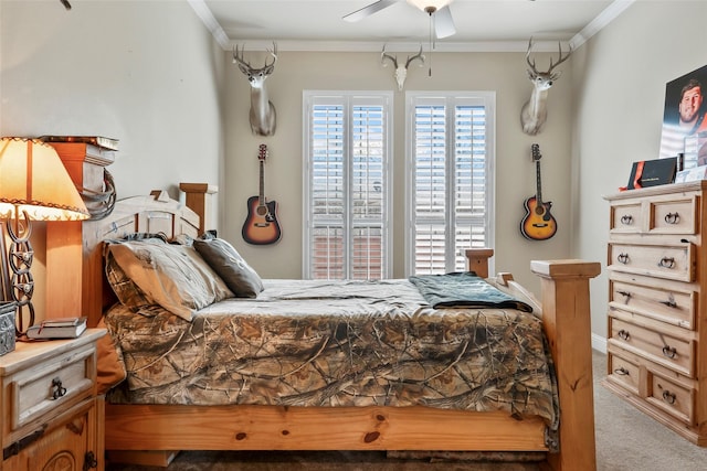 carpeted bedroom featuring a ceiling fan, crown molding, and baseboards