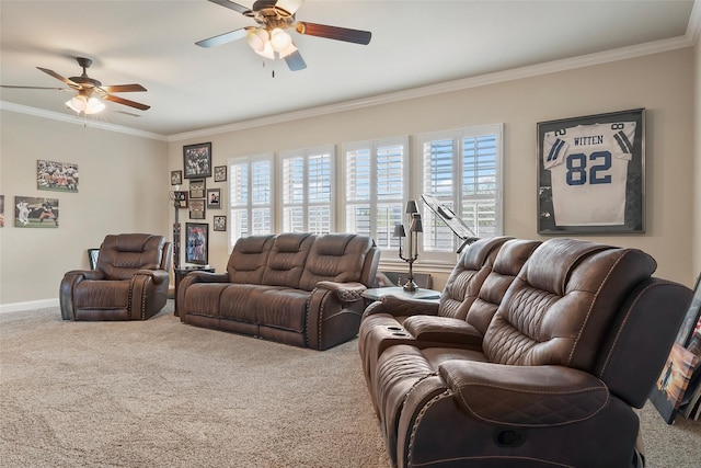 carpeted living room featuring a ceiling fan, ornamental molding, baseboards, and a healthy amount of sunlight