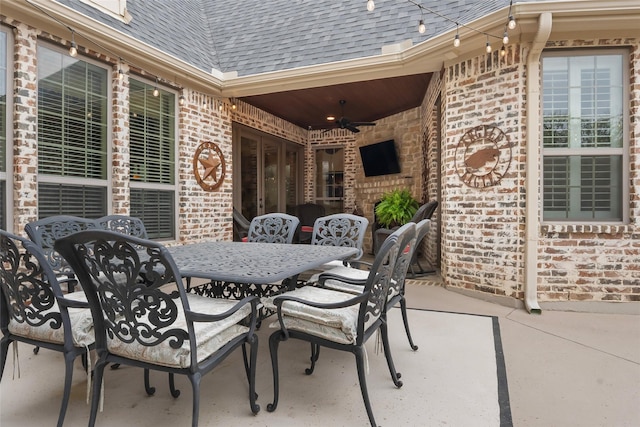 view of patio featuring outdoor dining area and ceiling fan