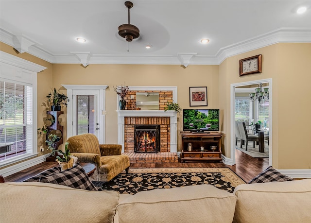 130 Vz County Road 3509, Edgewood, TX 75117 - living room with baseboards, ornamental molding, wood finished floors, and a brick fireplace