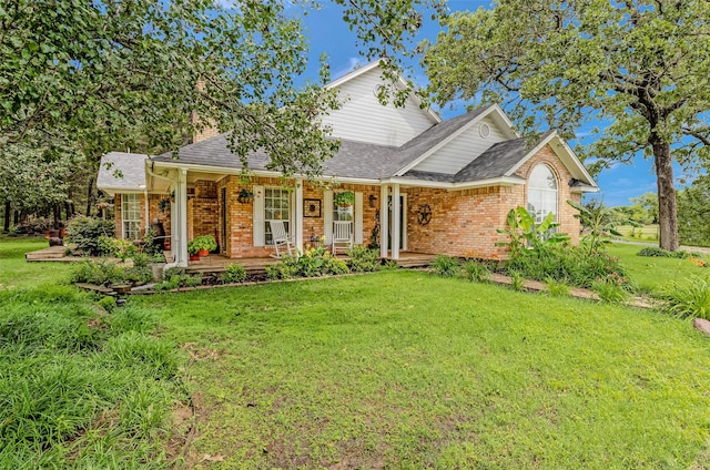 130 Vz County Road 3509, Edgewood, TX 75117 - view of front of property with a shingled roof, a front yard, and brick siding